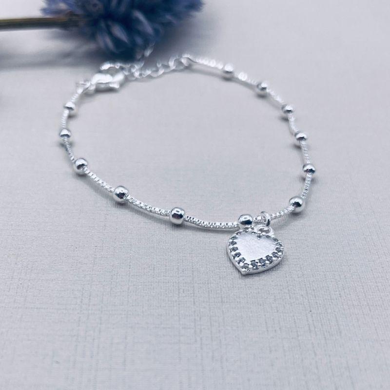 PULSEIRA BOLINHAS COM DETALHE CORACAO