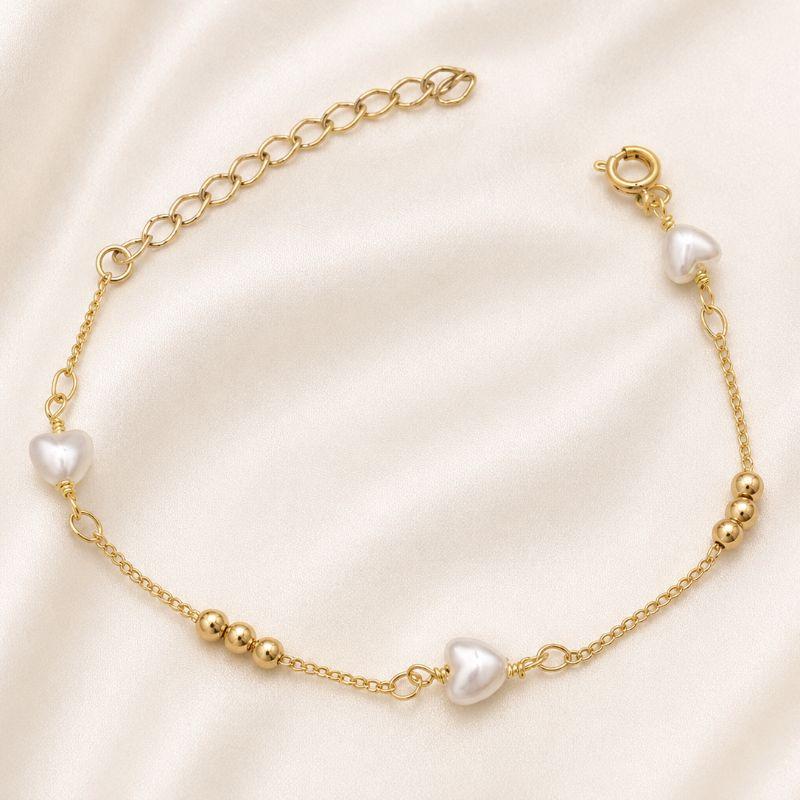PULSEIRA BOLINHAS E CORACAO DE PEROLA